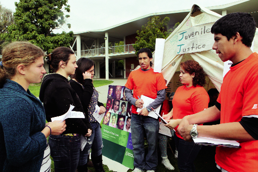 Palisades High Student Task Force members Oscar Ruiz, Kenia Jimenez and Paulis Ramos educate fellow students about youth who are serving life without parole sentences in California state prisons. They asked visitors to take action by signing a petition supporting SB 9, which would promote fair sentencing for youth in California. Juvenile justice was one of five issues that students discussed at PaliHi's Children's Rights Camp on March 2. Photo: Patricia Williams